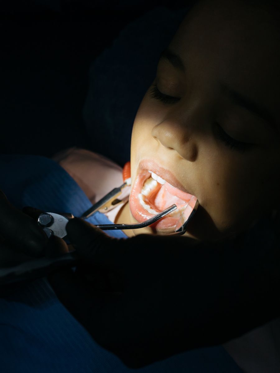 A cheerful child during a gentle dental check-up at a clinic